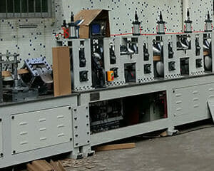 Paper edge protector making machine